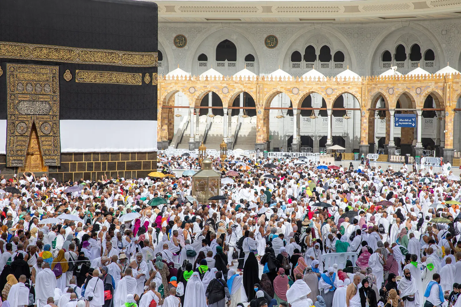 Thousands of pilgrims dressed in white circling the Kaaba in the Masjid al-Haram courtyard