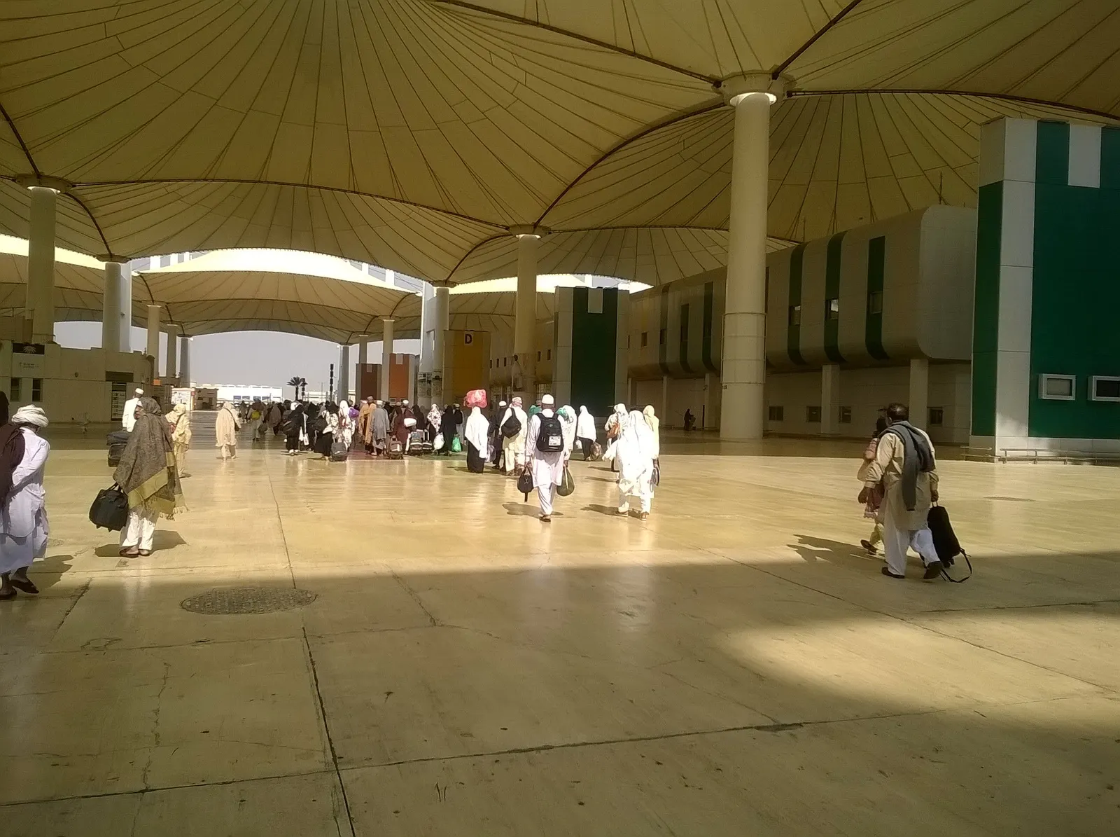 Travellers beneath the tent-like canopy of the Hajj Terminal at King Abdulaziz International Airport in Jeddah